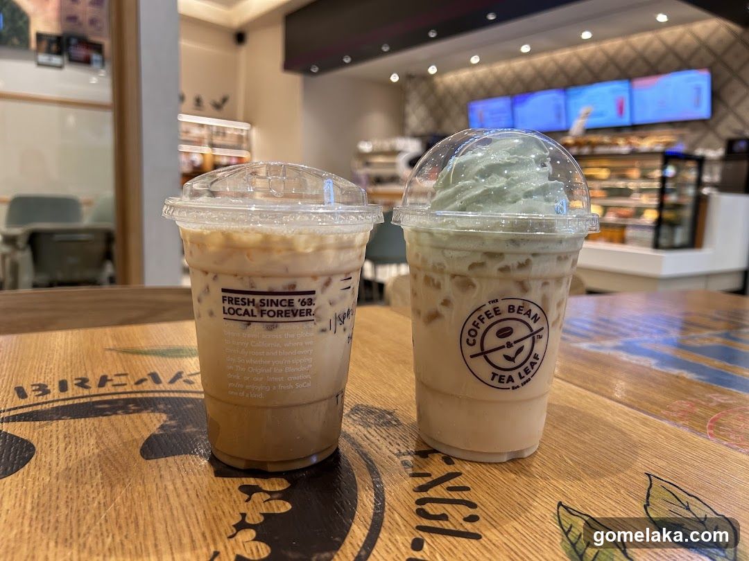 Two iced beverages on a wooden table