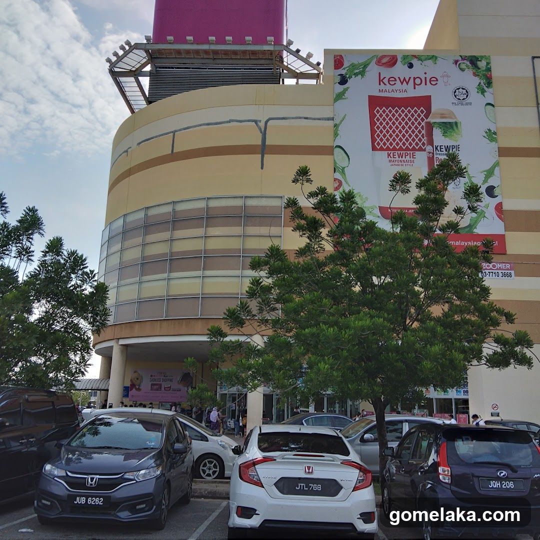Shopping Mall Exterior with Promotional Poster