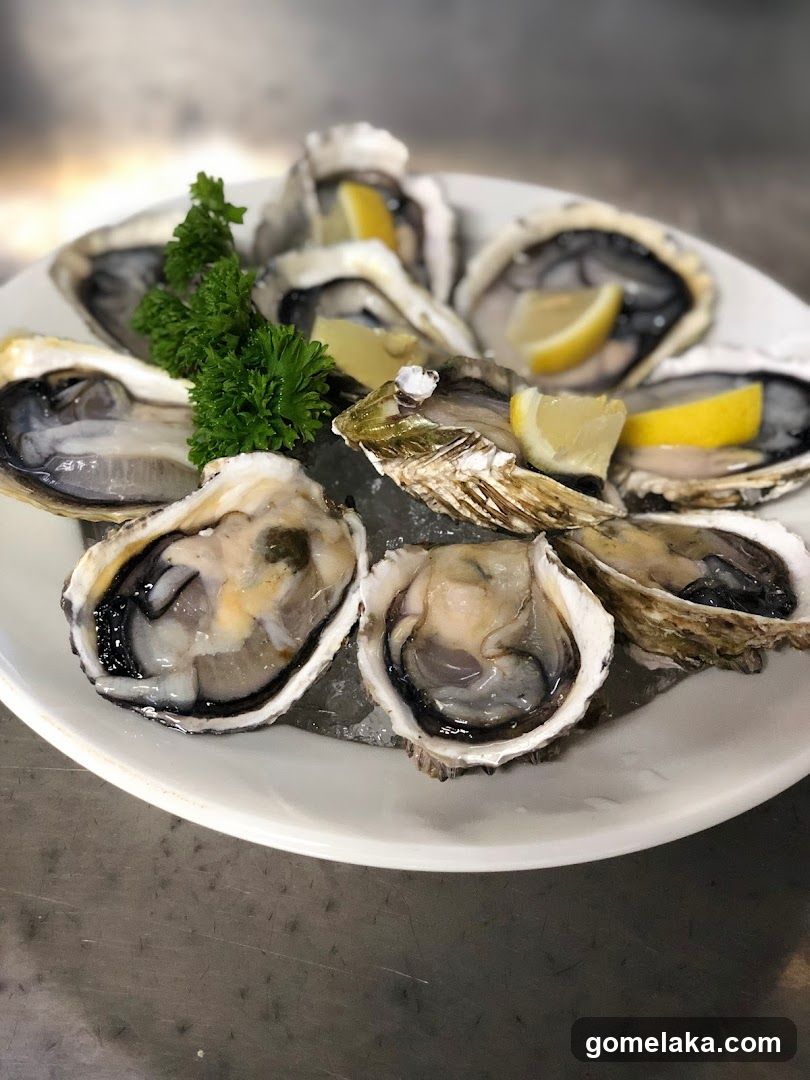 Oysters on ice with lemon and parsley
