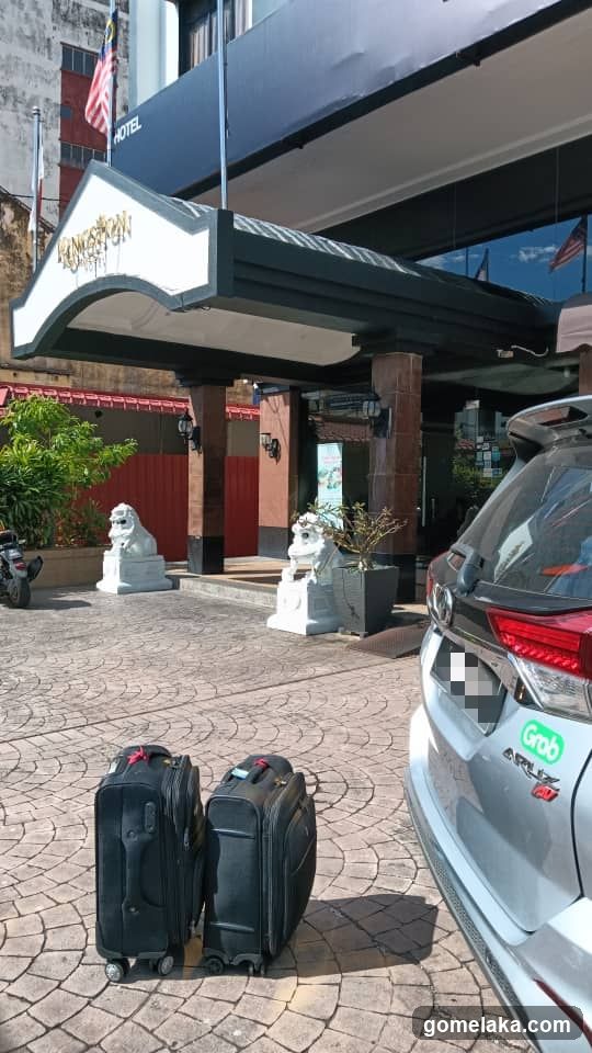 Hotel Entrance with Luggage and Car