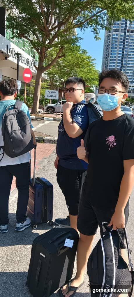 People with luggage on street