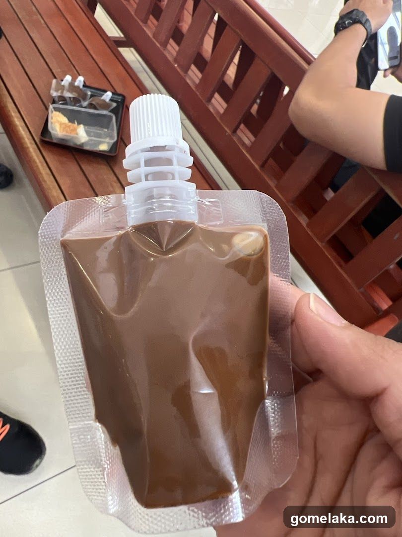 Hand holding beverage pouch