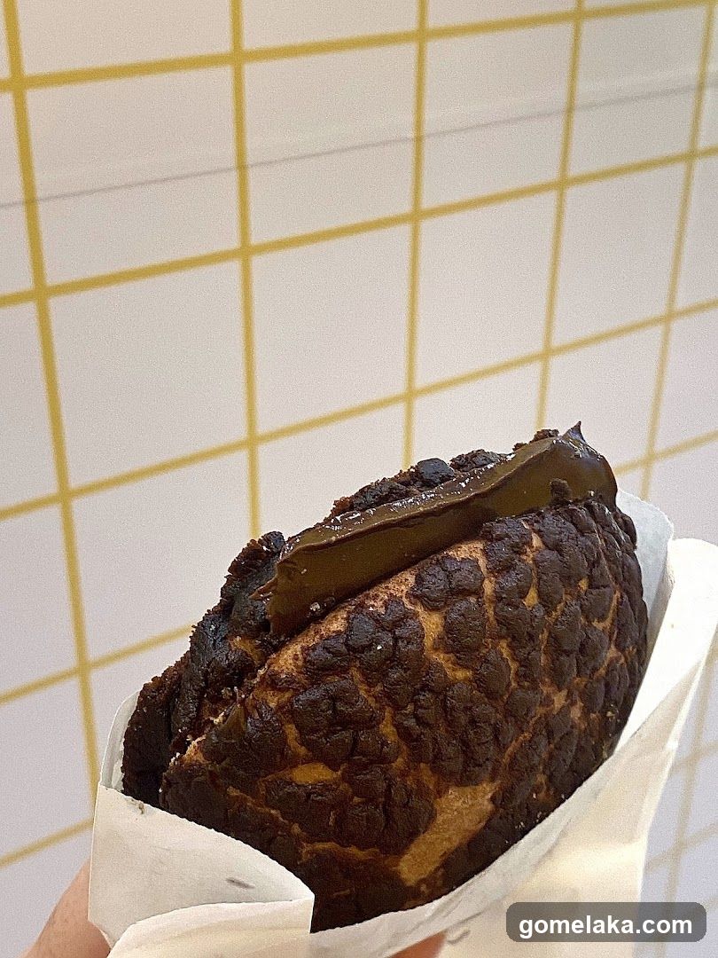 Chocolate pastry in hand