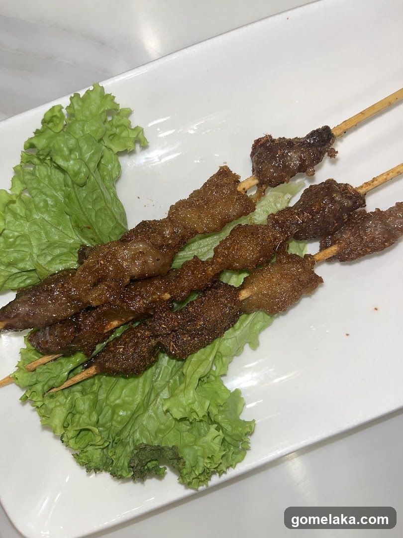 Grilled Meat Skewers on Lettuce