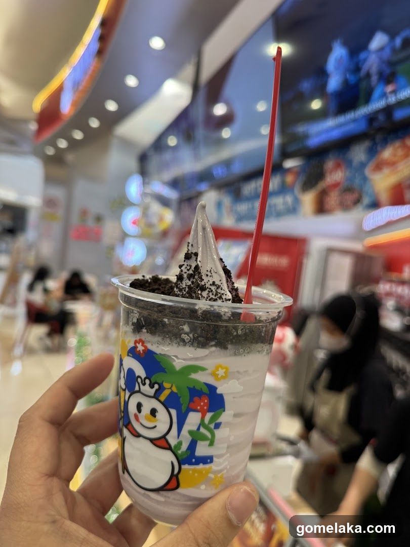 Hand holding dessert cup in store