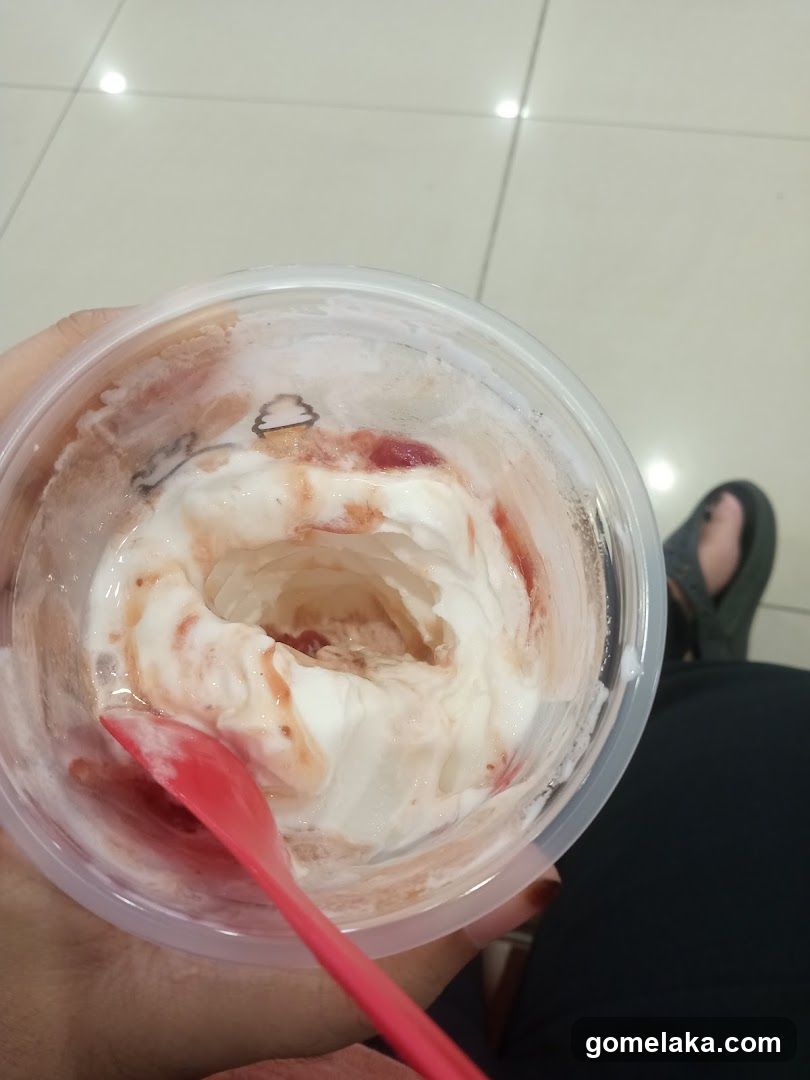 Hand holding dessert cup
