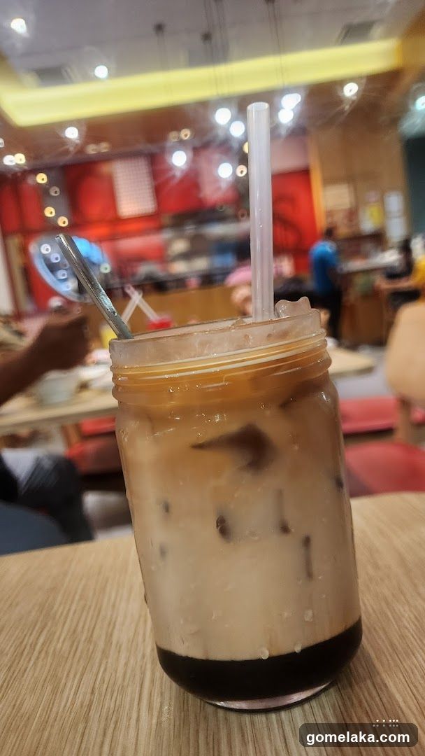 Iced beverage in mason jar at café