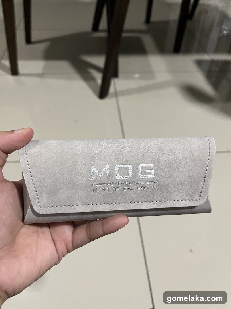 Hand holding eyewear case