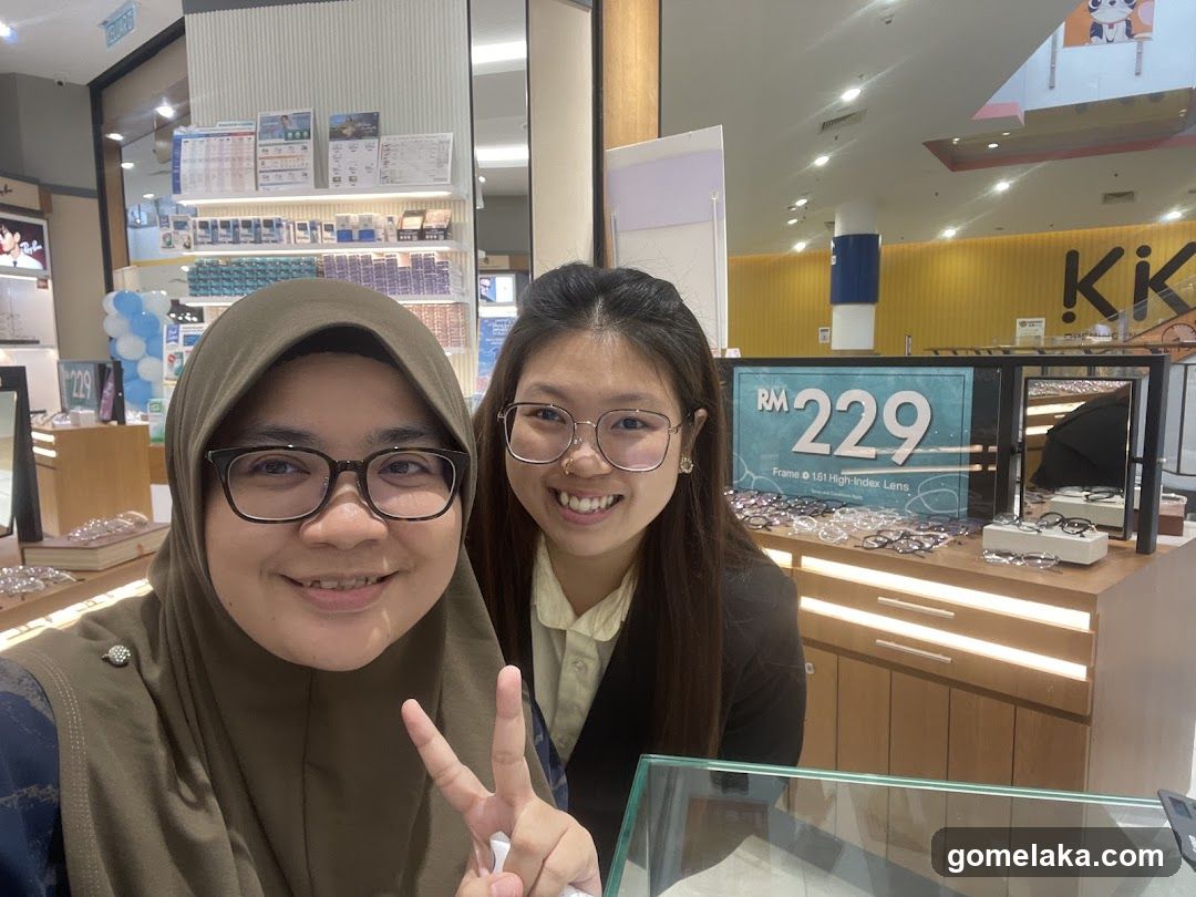 Two individuals in eyewear store interior