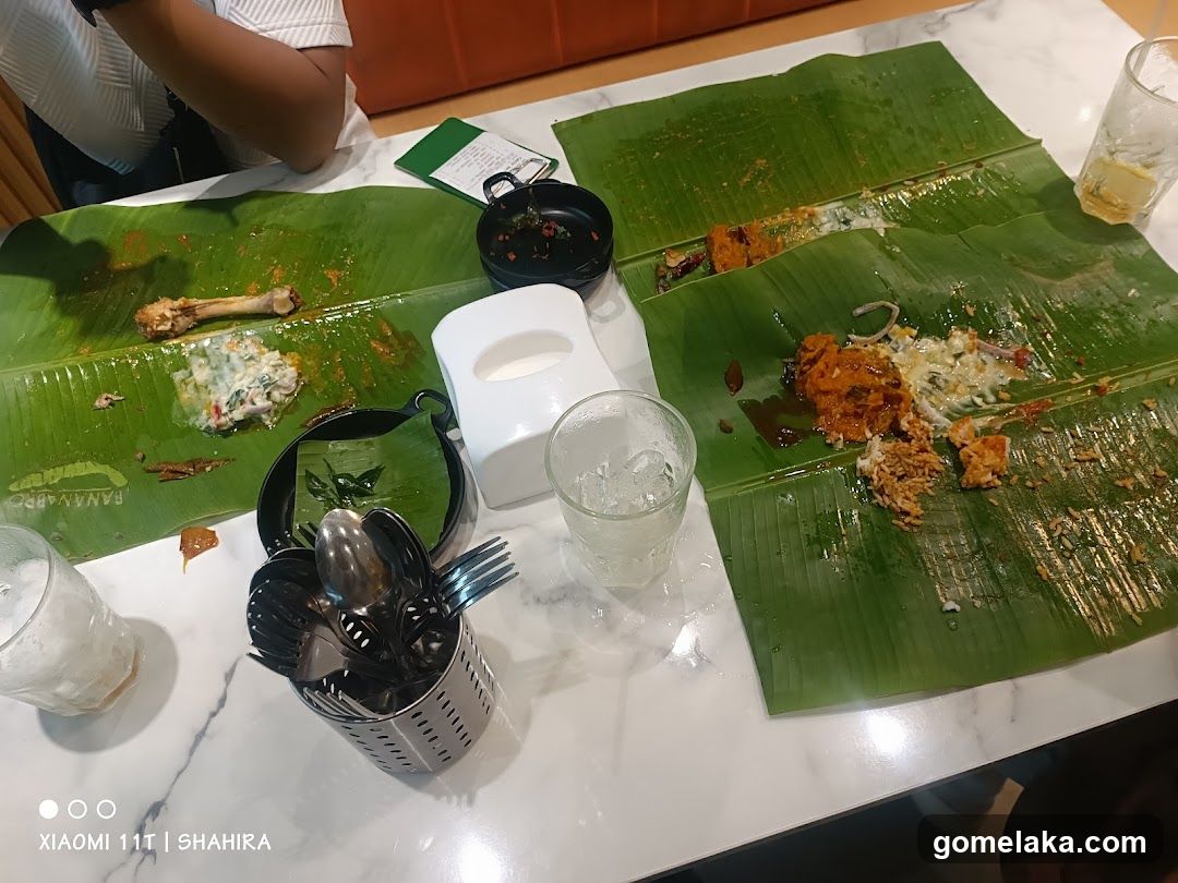 Restaurant Table with Banana Leaf Meal Remains