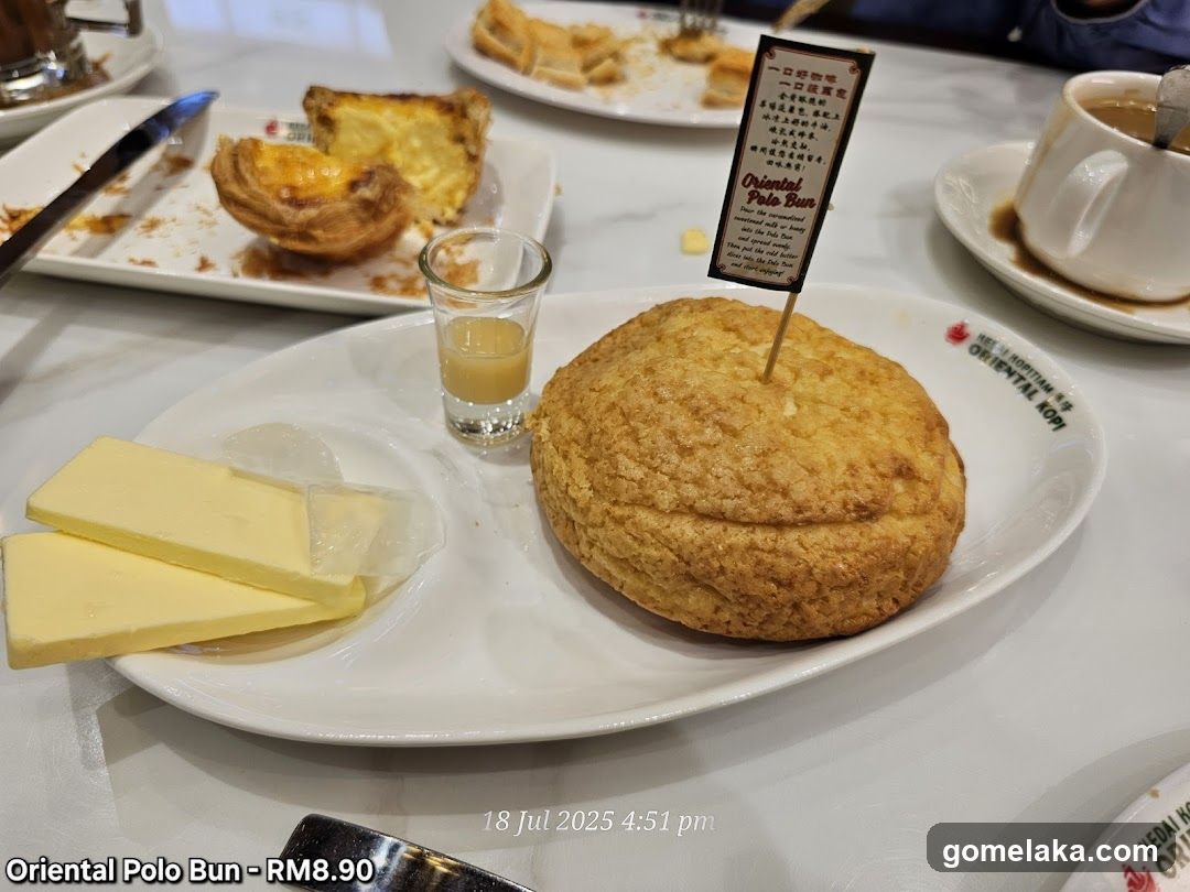 Oriental Polo Bun served with butter and a shot of sauce