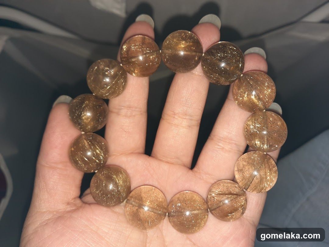 Hand holding a bracelet