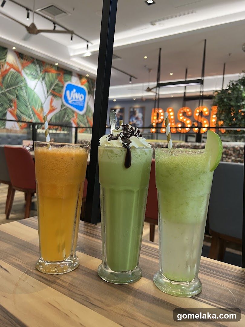Three beverages on a wooden table in a café interior
