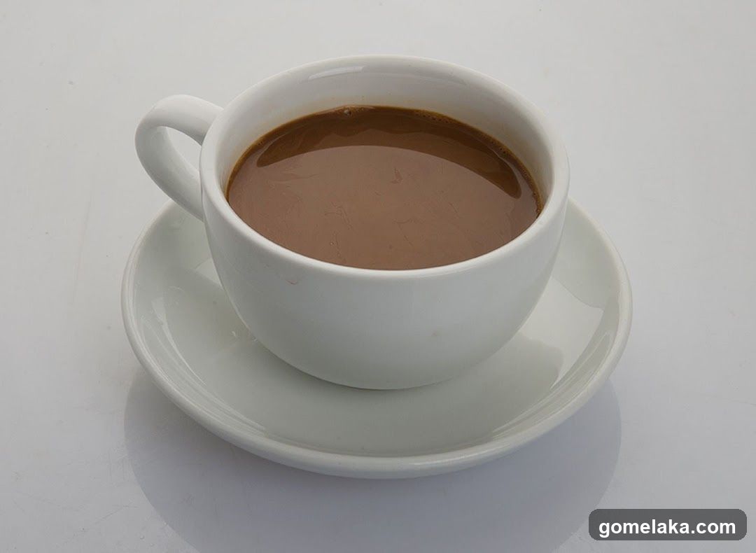 Coffee in a white cup and saucer
