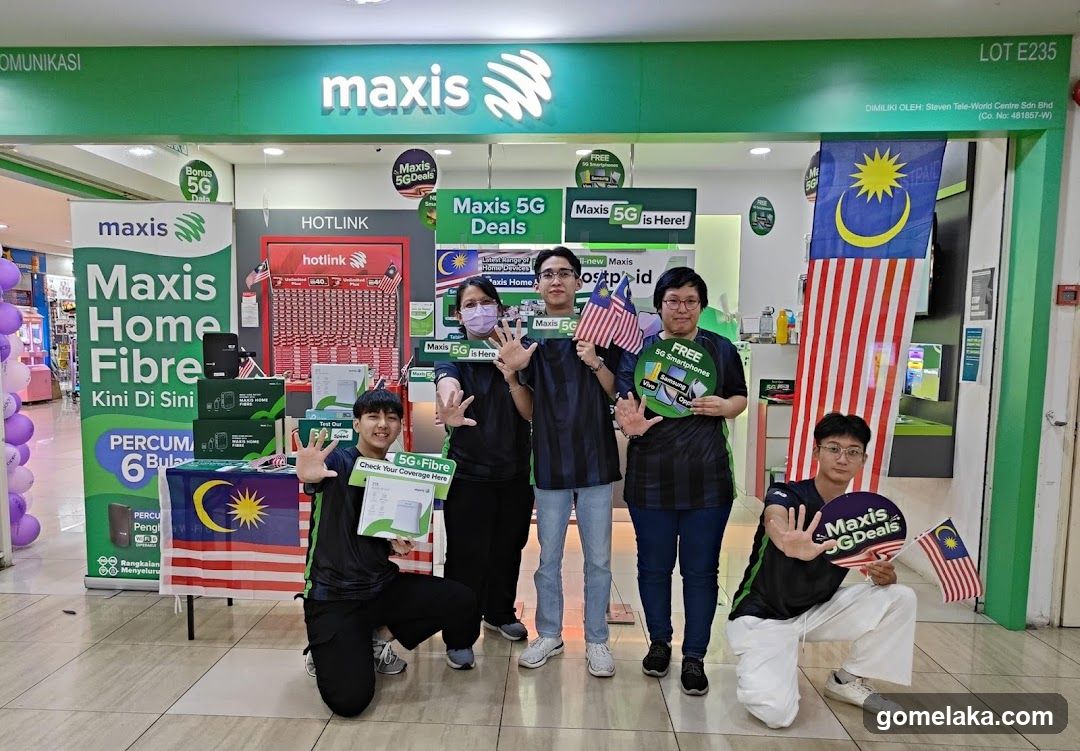 Maxis Storefront with Staff and Promotional Displays