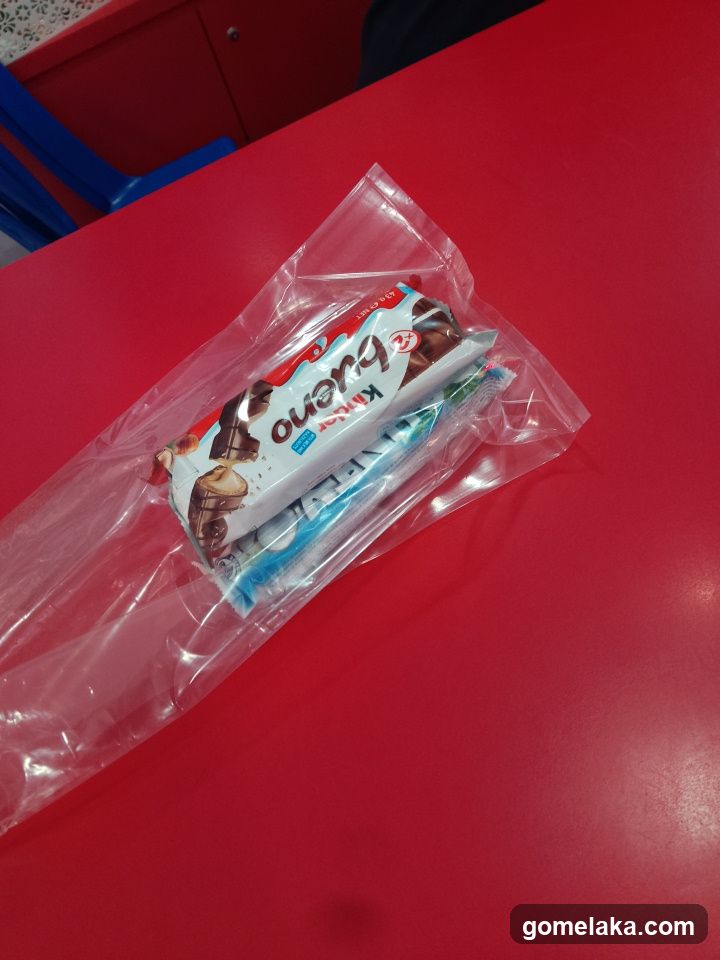 Wrapped Chocolate Bar on Red Surface