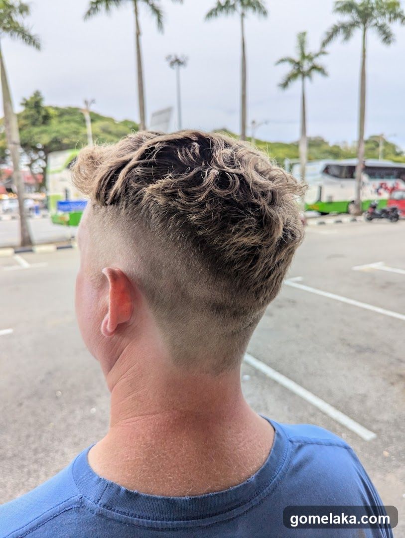 Person with haircut outdoors