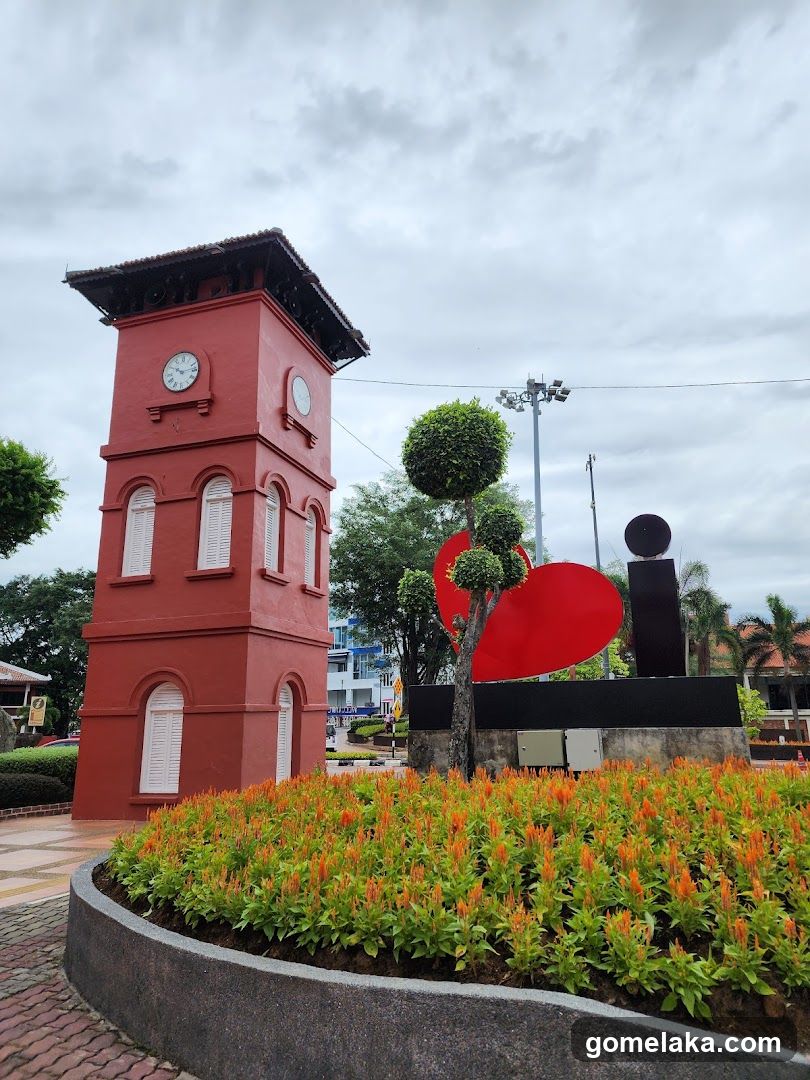 Red Clock Tower and Sculpture