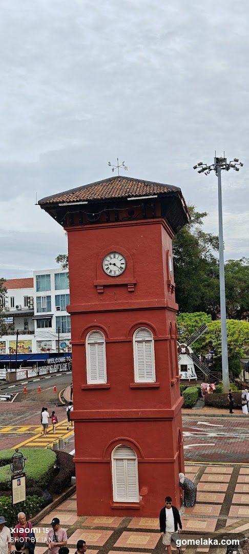 Red Clock Tower in Urban Square