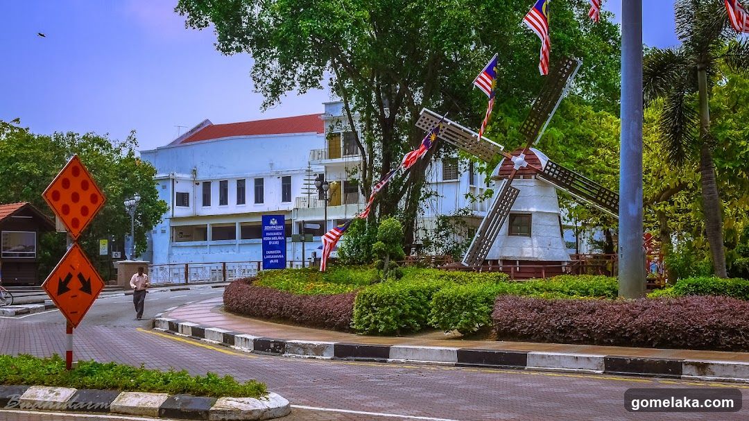 Outdoor Public Area with Windmill and Building