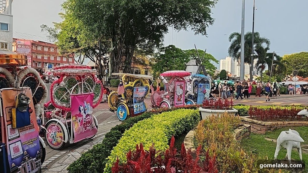 Public Square with Decorated Carriages and People