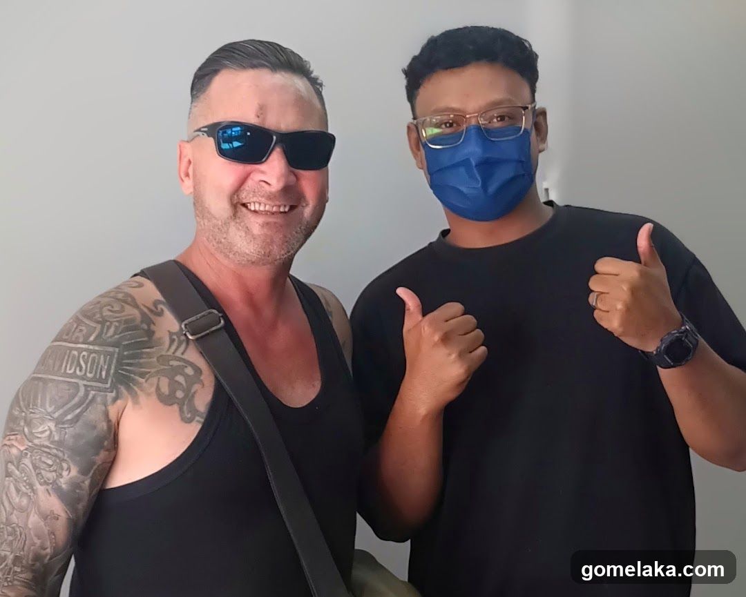 Two individuals posing for a photo