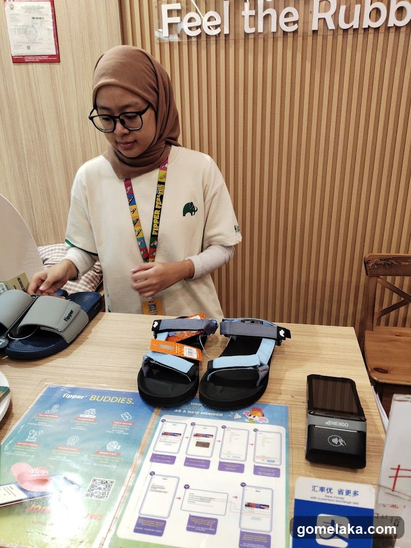 Staff at counter with products and promotional materials
