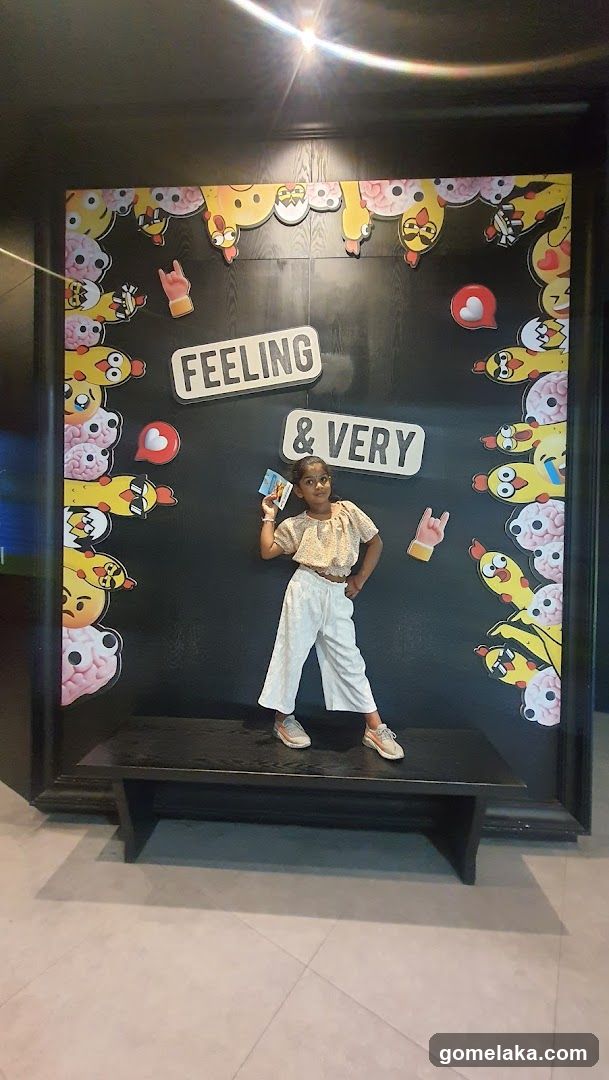 Child posing in front of decorative wall