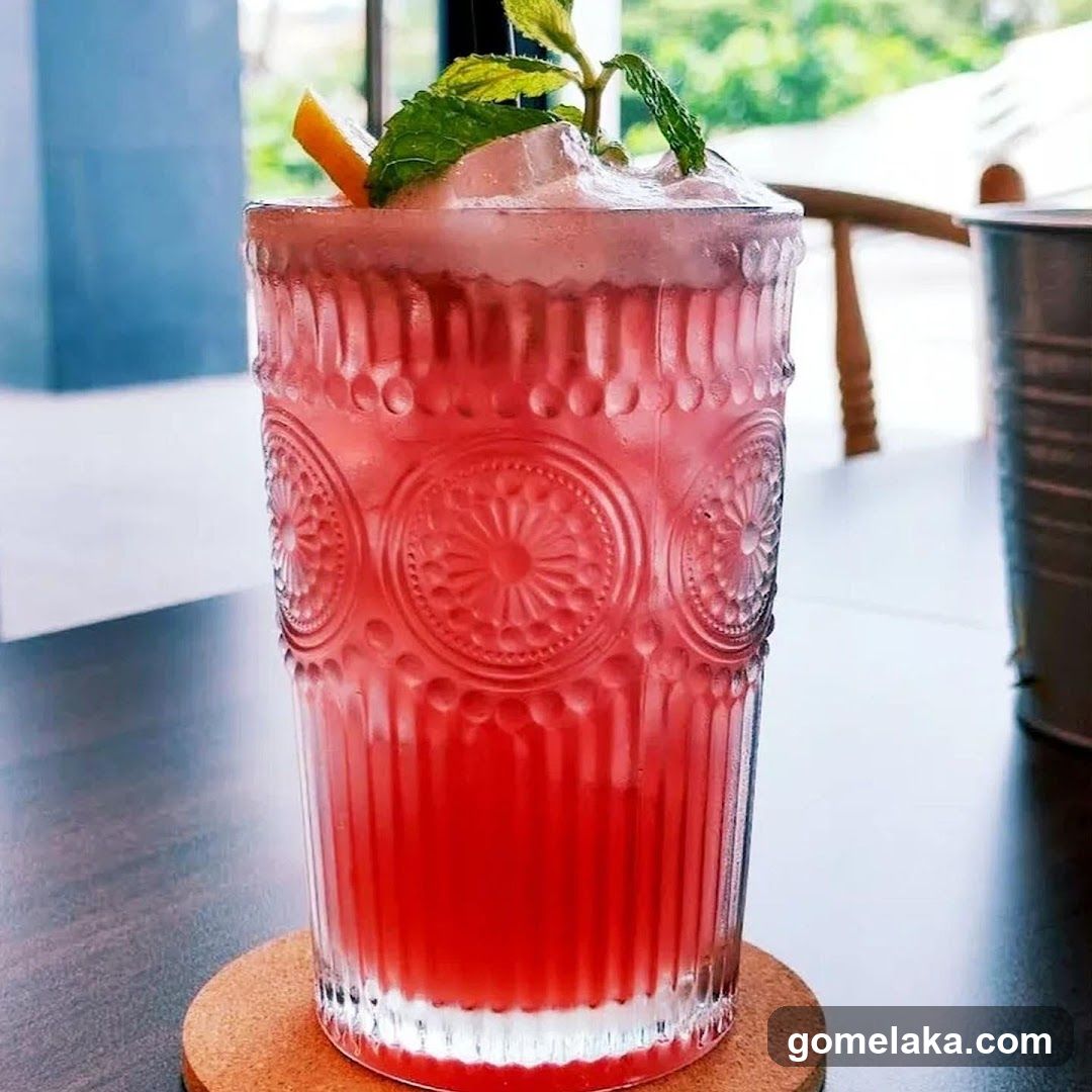 Red beverage in decorative glass