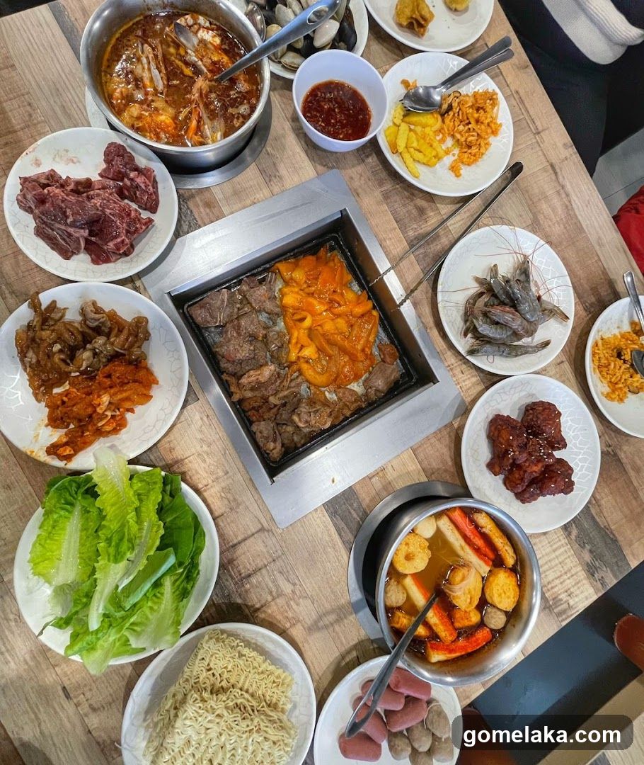Table with Korean BBQ and side dishes