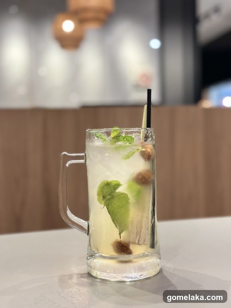 Drink in mug with mint and fruit