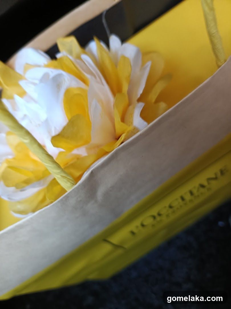 L'Occitane shopping bag with decorative flower