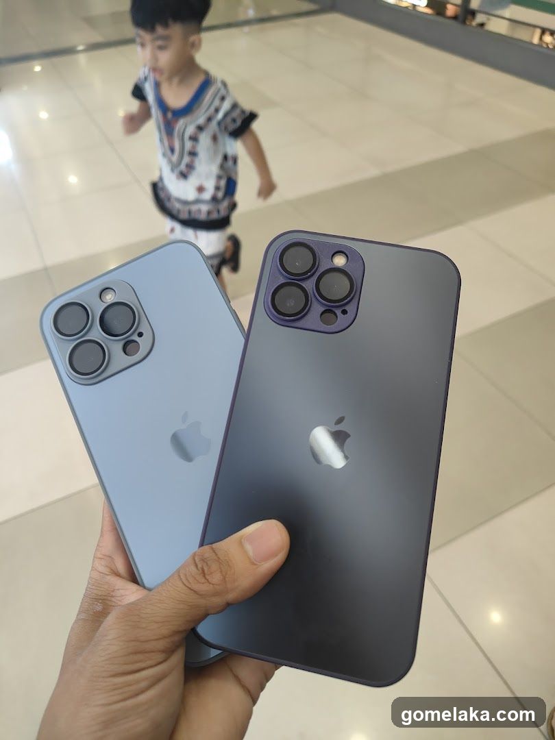 Hand Holding Two iPhones in Mall