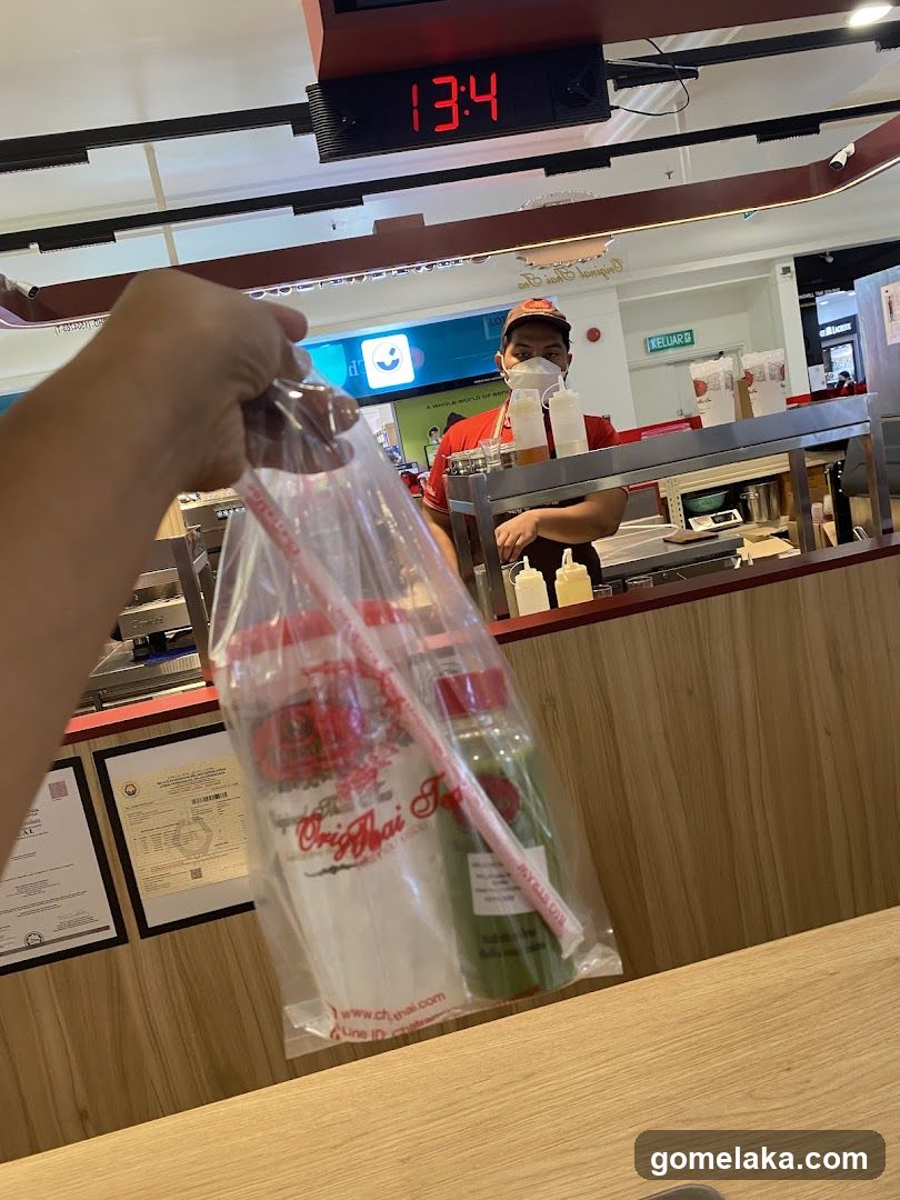Customer holding bag at counter