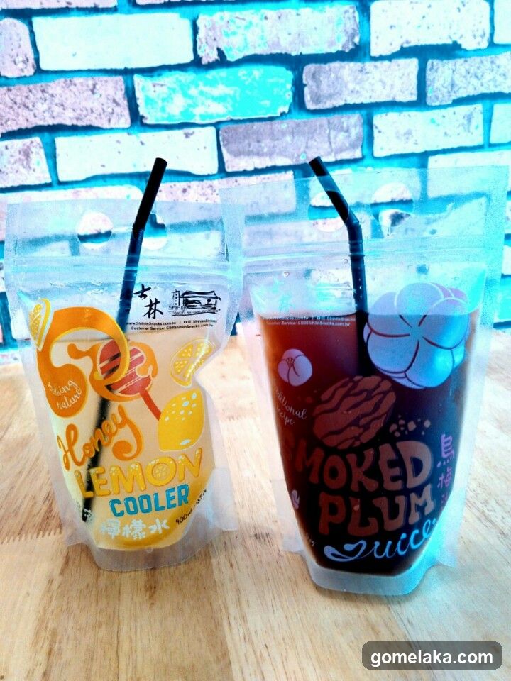 Two juice pouches on wooden surface
