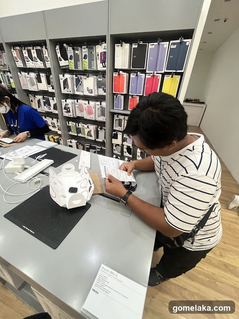 Customer at electronics store counter