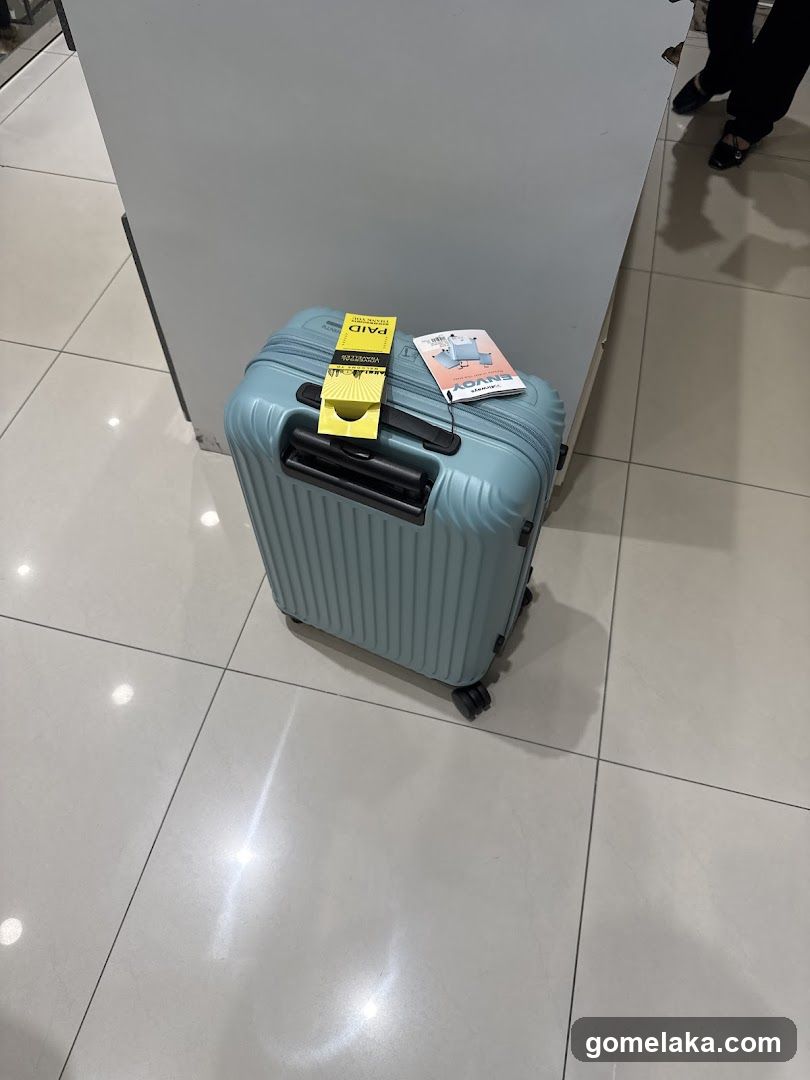 Blue suitcase on tiled floor