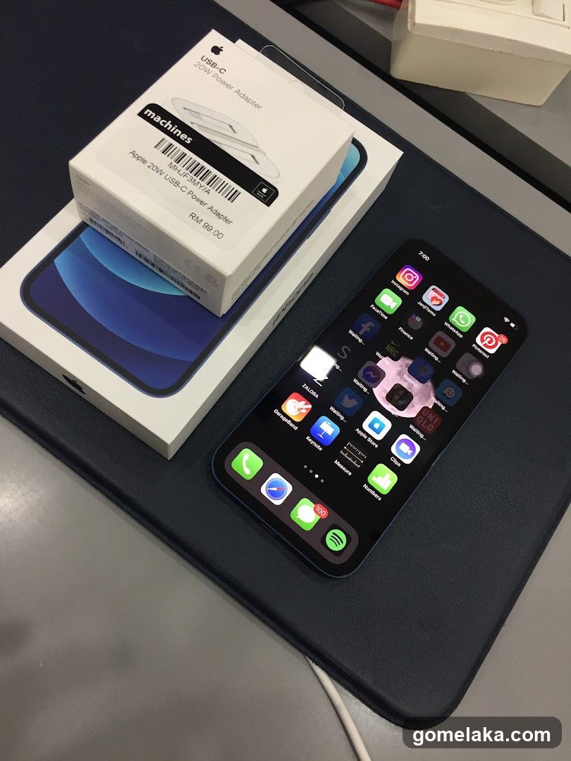 iPhone and USB-C Adapter on Display Surface