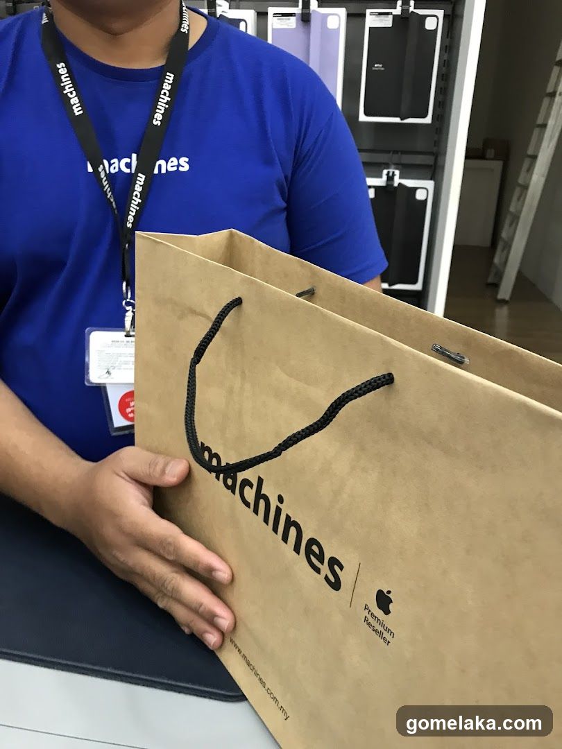 Staff Holding Shopping Bag