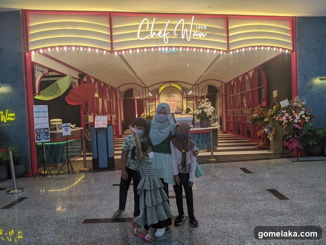 Group photo in front of restaurant entrance