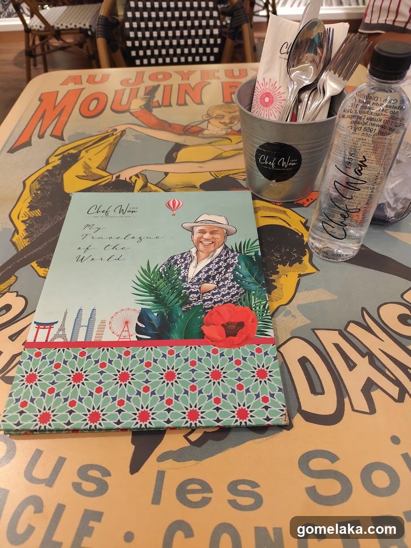Table with printed materials and drink