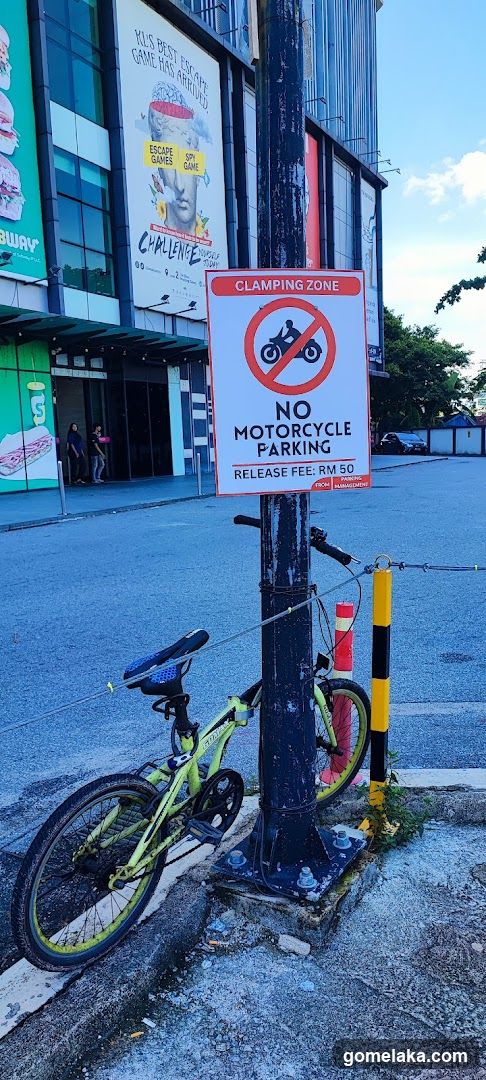 Street Scene with Motorcycle Parking Sign and Bicycle