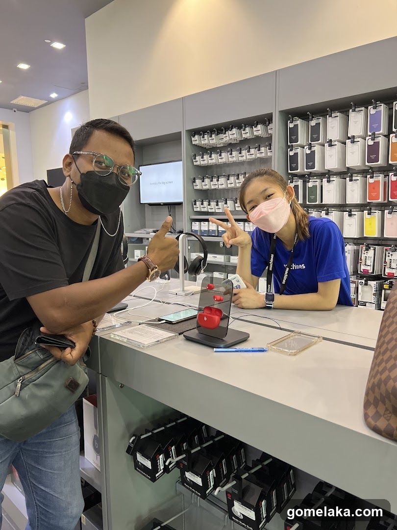 Customer and Staff in Electronics Store