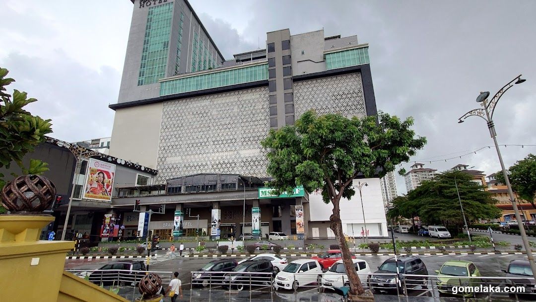 Building Exterior with Traffic and Greenery