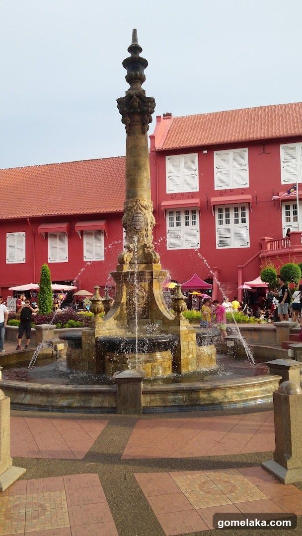 Fountain and Red Building