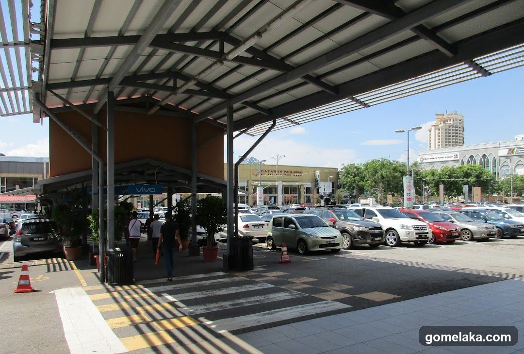 Outdoor parking area with covered walkway