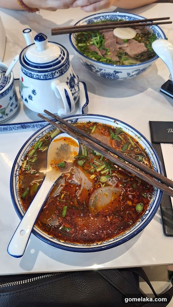 Table setting with noodle dishes and teapot