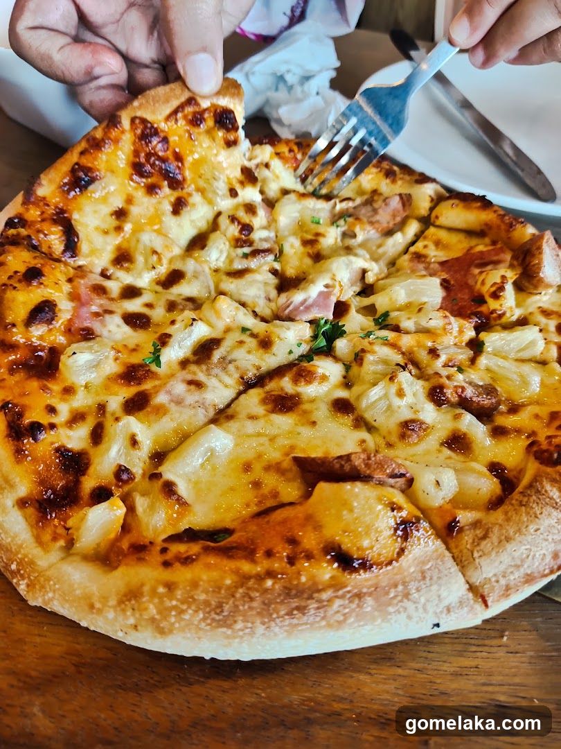 Pizza being sliced