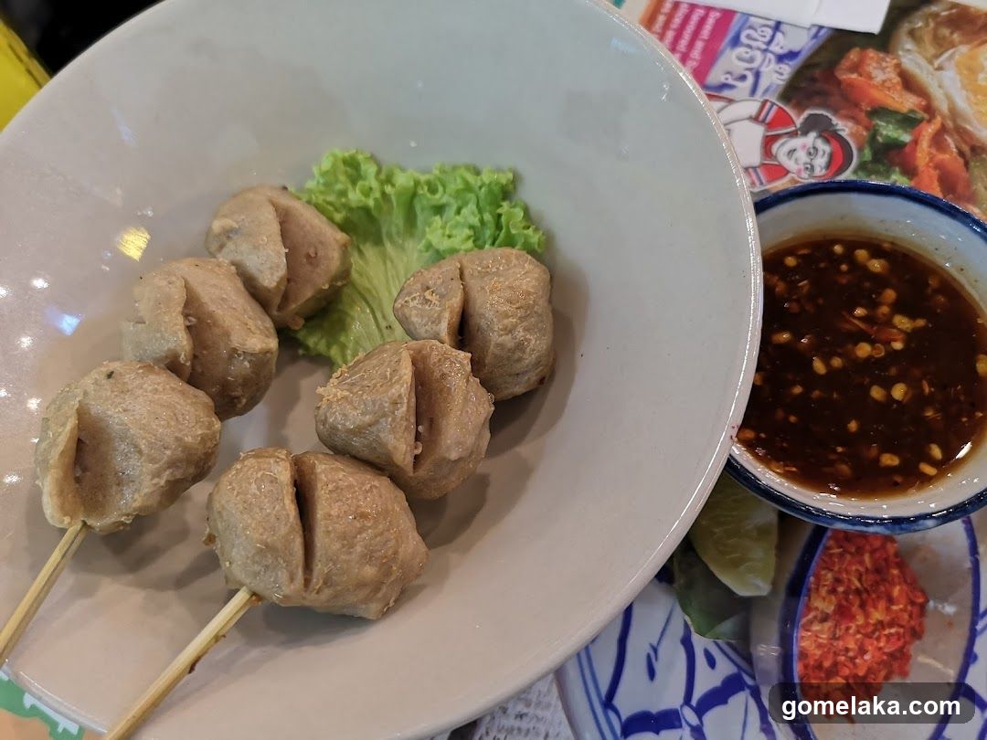 Food Plate with Skewered Meatballs and Sauce