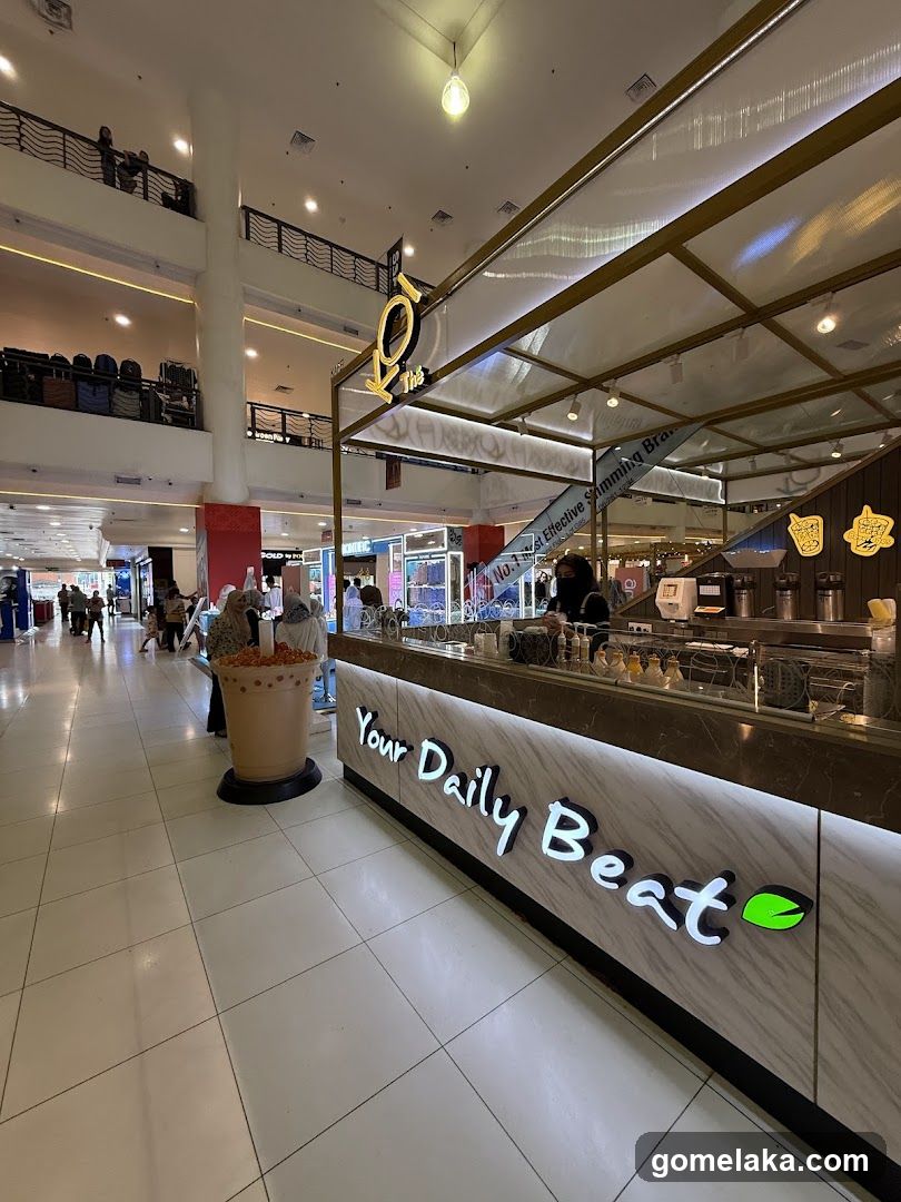 Interior of shopping mall with beverage stall